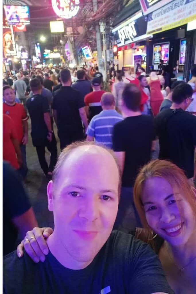 bangla road in Phuket at night. in the picture it shows Chris Verhoeven and Saengduan verhoeven having a good time at the bars and showing the crowd